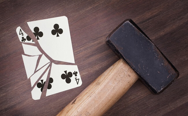 Hammer with a broken card, vintage look, four of clubs